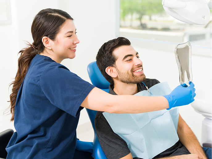 orthodontist-and-patient-smiling-in-office